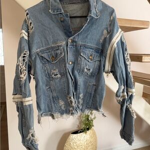 One of a kind vintage Distressed Denim Jacket from LF the brand Carmar